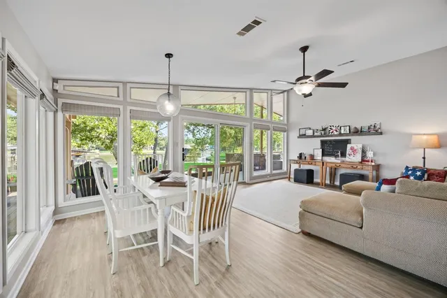 a view of a livingroom with furniture window and wooden floor
