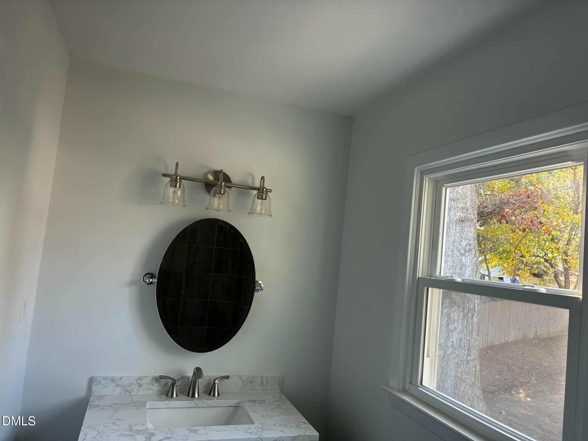 3415 Carolyn Drive Raleigh, NC 27604 - Photo 13 of 30 a room with a mirror and a window