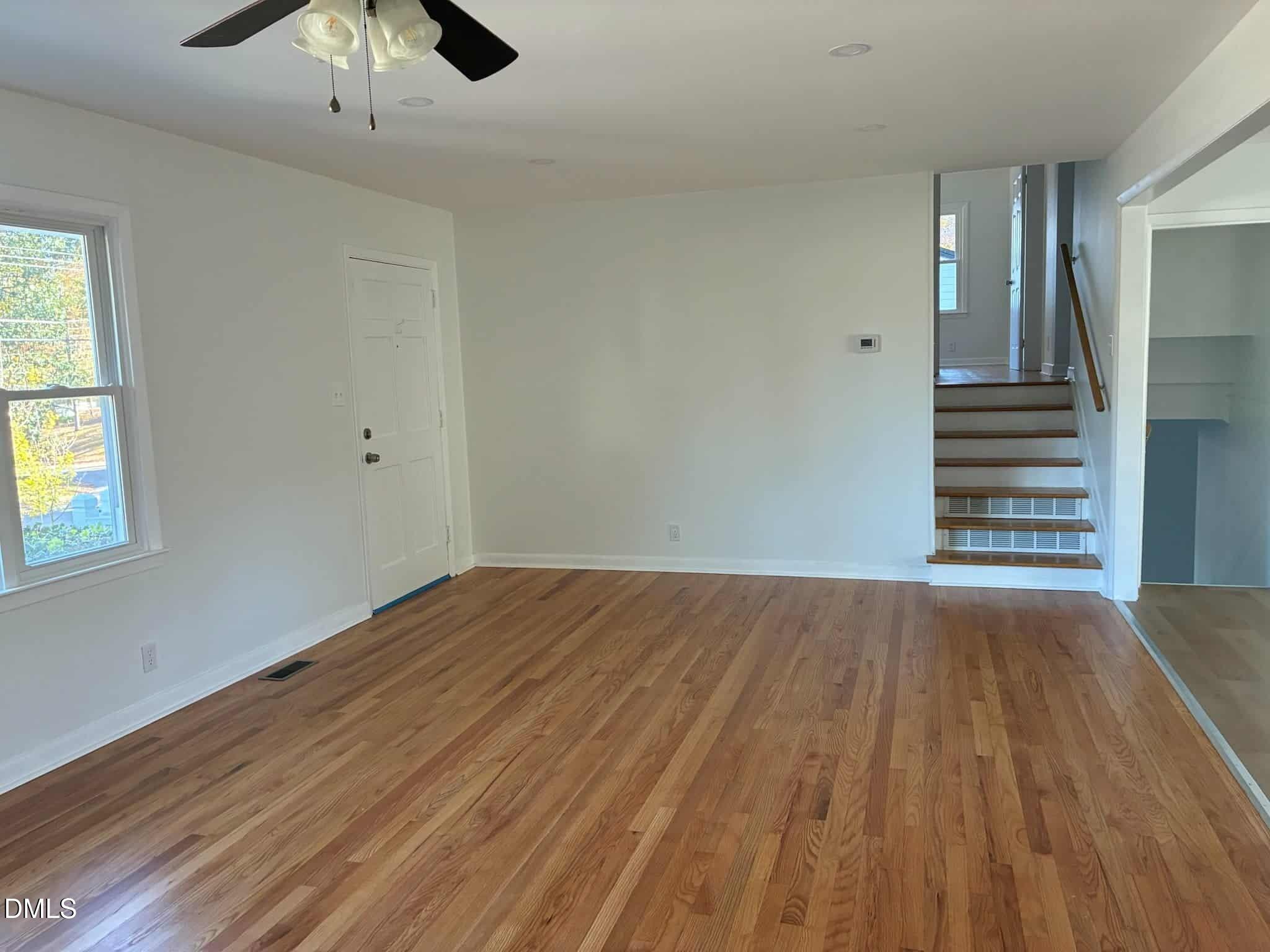 3415 Carolyn Drive Raleigh, NC 27604 - Photo 2 of 30 wooden floor in an empty room with a window