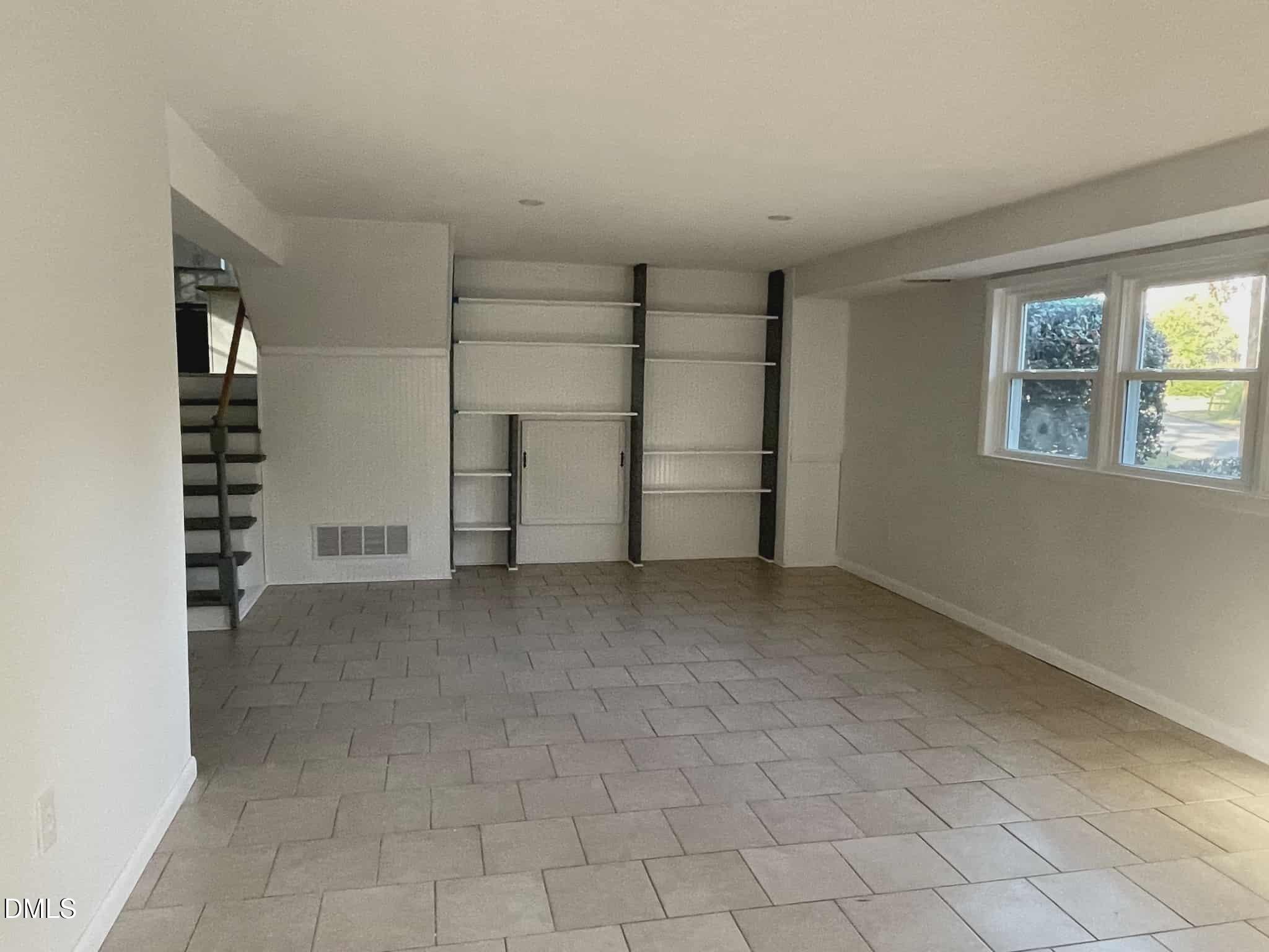 3415 Carolyn Drive Raleigh, NC 27604 - Photo 24 of 30 a view of a closet area with empty racks