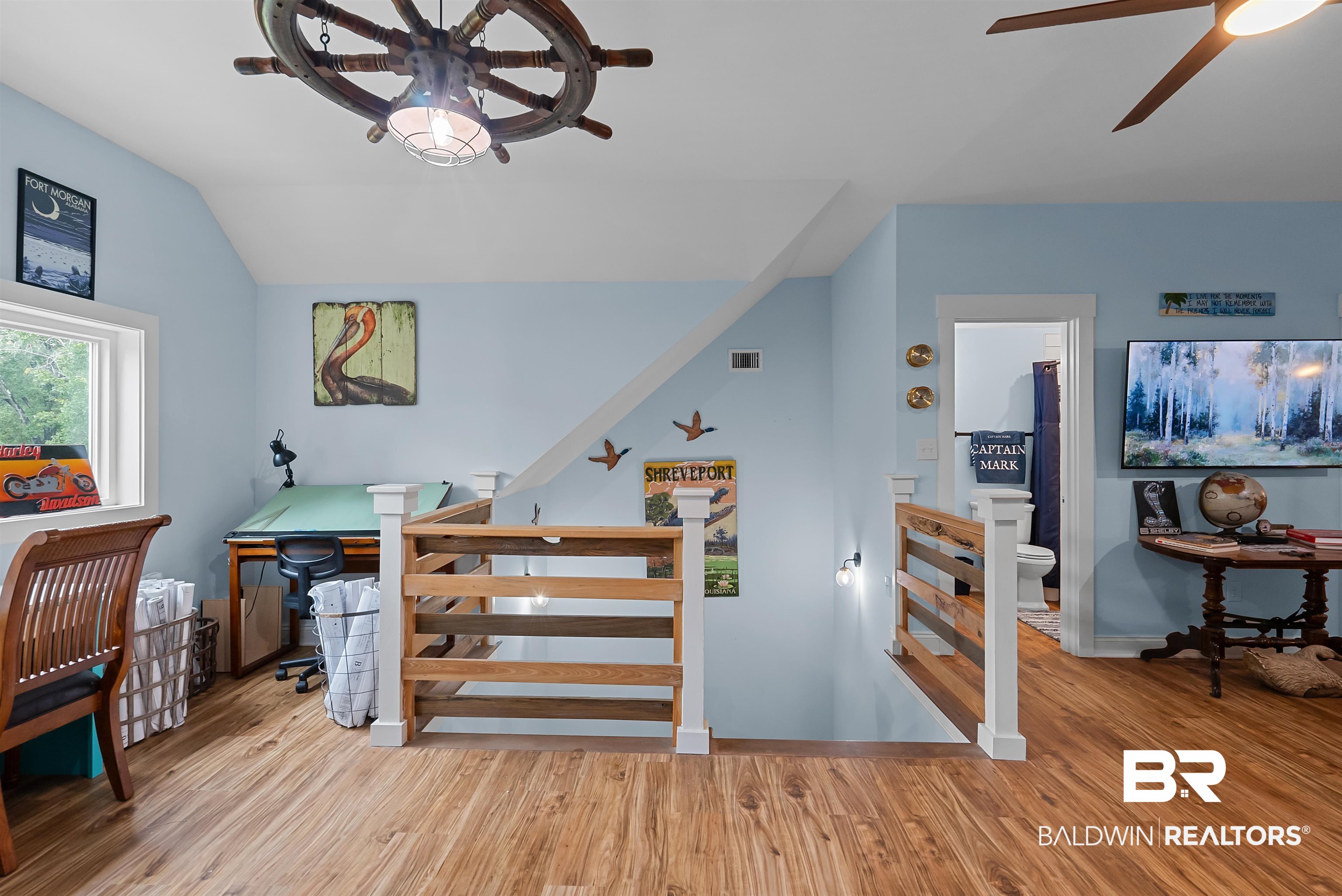 7266 Franklin Road Foley, AL 36535 - Photo 46 of 64 Open loft area featuring wood-finish flooring and light blue walls