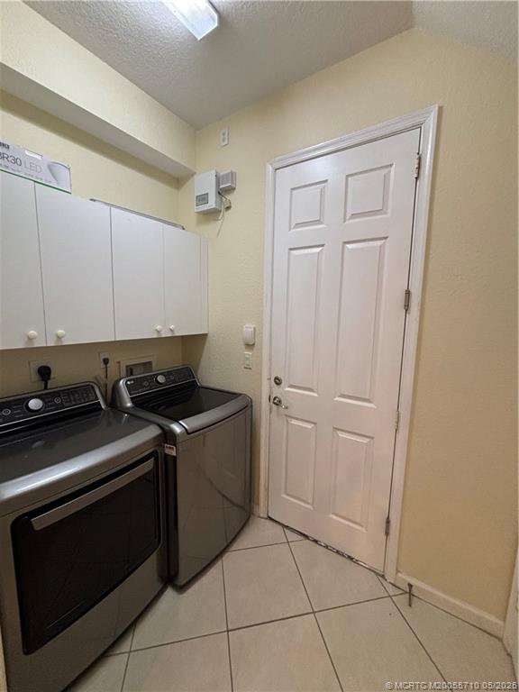 262 Southwest Walking Path, Unit 262 Stuart, FL 34997 - Photo 4 of 39 a stove top oven sitting inside of a kitchen