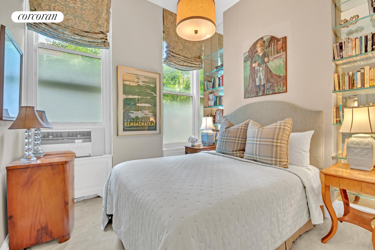 7 Beekman Place, Unit 14 Manhattan, NY 10022 - Photo 13 of 21 a bedroom with a bed and a dresser next to a window