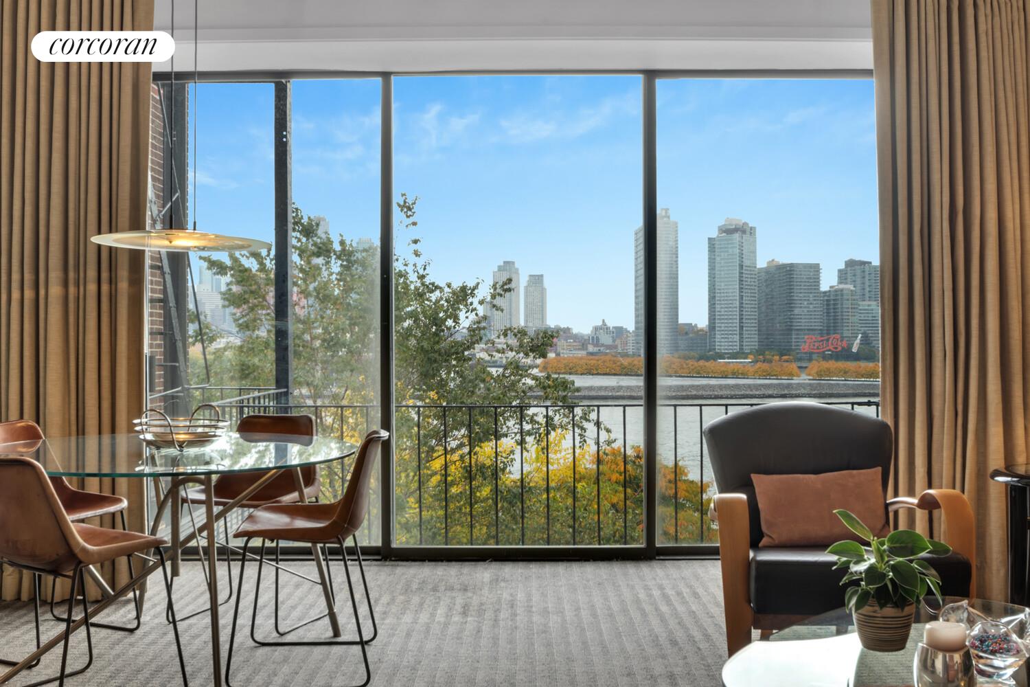 7 Beekman Place, Unit 14 Manhattan, NY 10022 - Photo 15 of 21 a view of a room with a furniture and floor to ceiling window