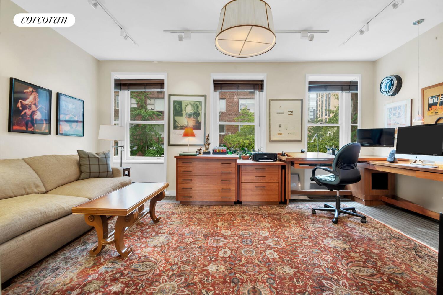 7 Beekman Place, Unit 14 Manhattan, NY 10022 - Photo 17 of 21 a living room with furniture a dining table and a large window