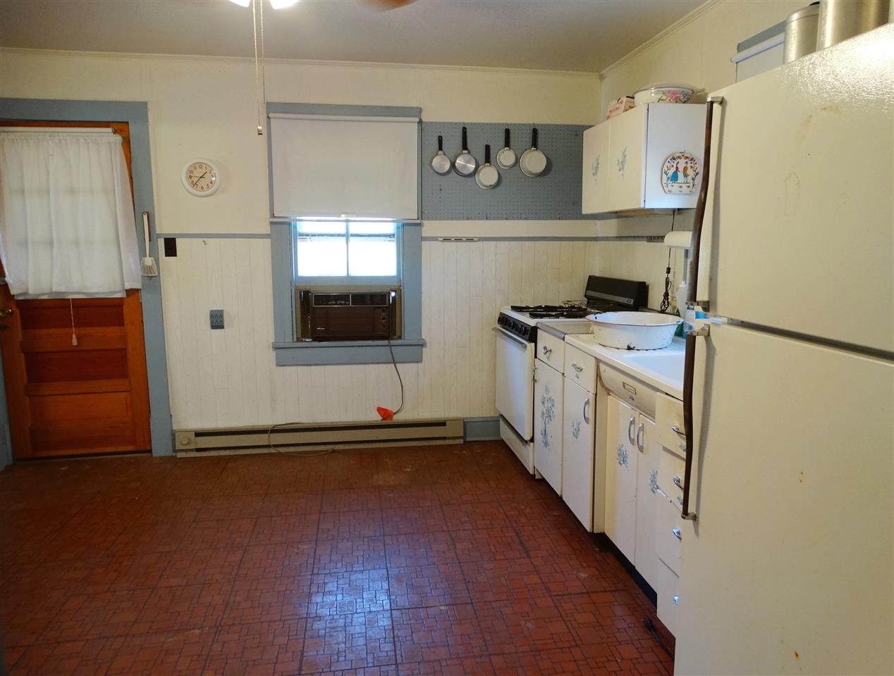 267 Mitchell Mountain Road Reva, VA 22735 - Photo 9 of 19 a kitchen with stainless steel appliances a refrigerator and a stove top oven