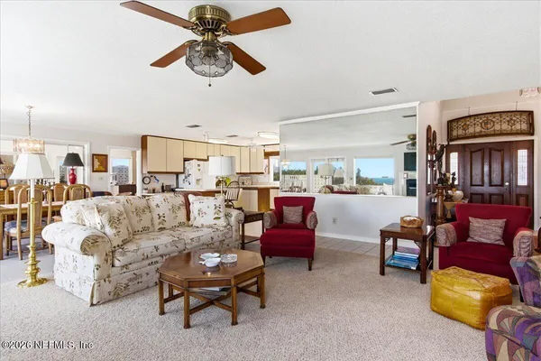 a view of a dining room with furniture window and outside view