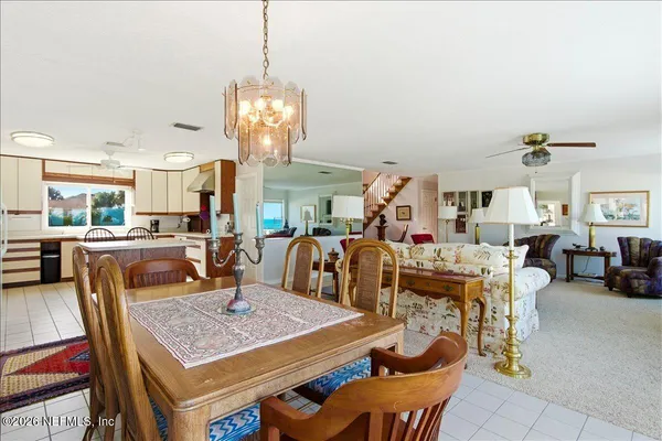 a room with pool table and windows