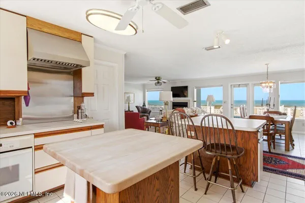 a bedroom with a large bed and a large window