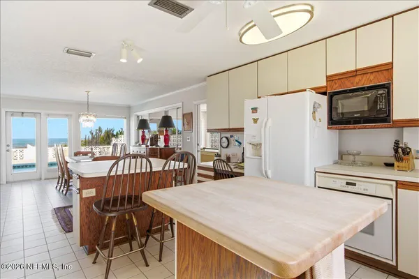 a bedroom with a bed and a table