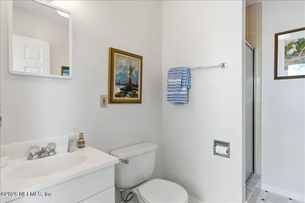 a bedroom with two beds and a dresser