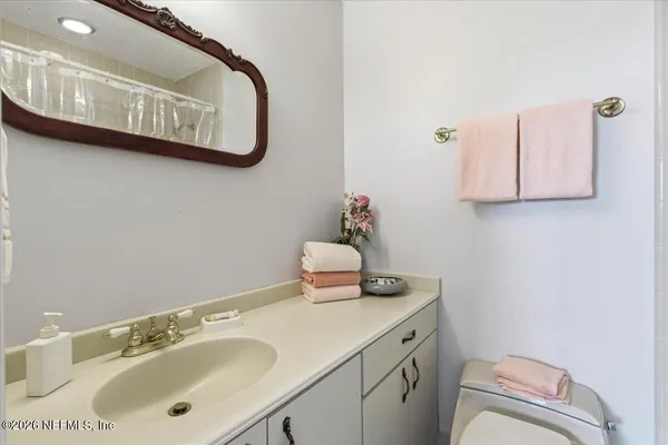a view of swimming pool with a chairs