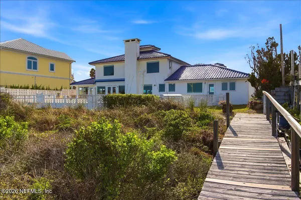 an aerial view of a house with a lake view