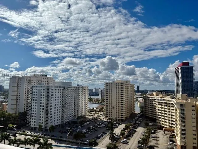 a kitchen with stainless steel appliances granite countertop a refrigerator and a stove