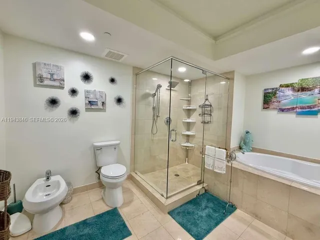 a bathroom with a shower and toilet