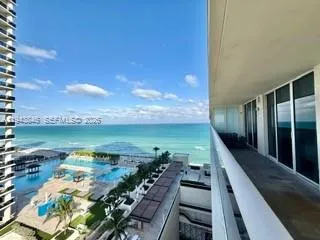 a view of a balcony with an ocean