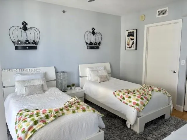 a kitchen with a refrigerator and cabinets