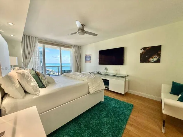 a bedroom with two beds and a window