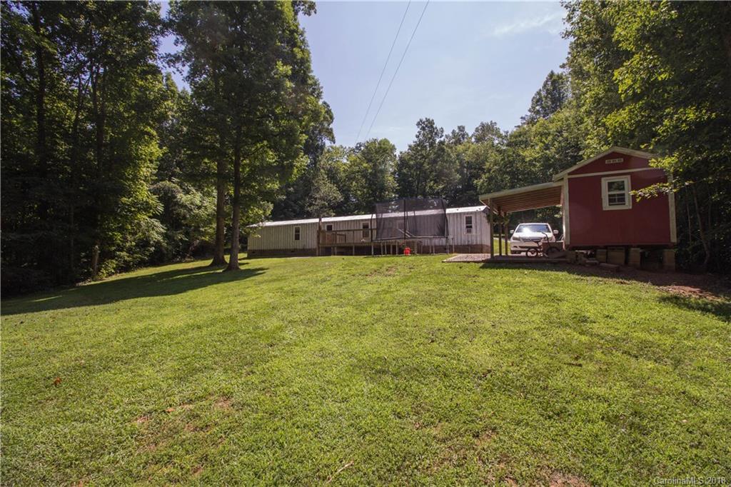 2389 Rock Road Rutherfordton, NC 28139 - Photo 22 of 28 a view of a house with a yard