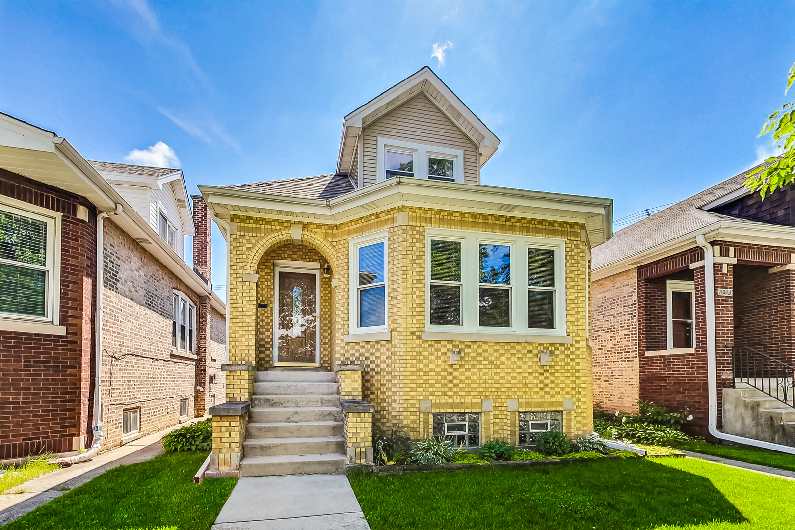 3025 North Rutherford Avenue Chicago, IL 60634 - Photo 1 of 46 a front view of a house with a yard
