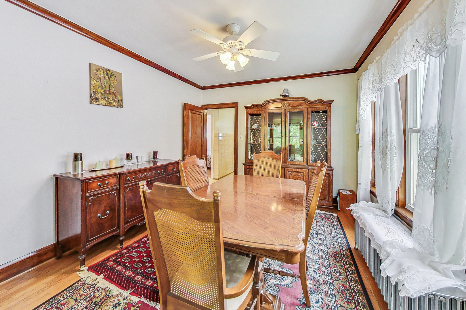 3025 North Rutherford Avenue Chicago, IL 60634 - Photo 7 of 46 a dining room with furniture a rug and a large window