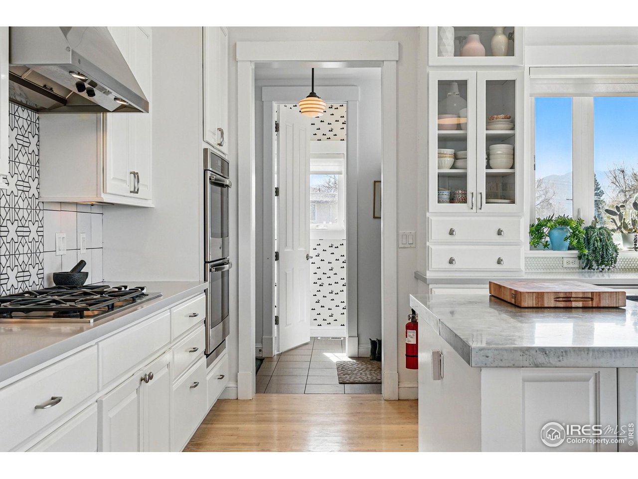 7531 Spring Drive Boulder, CO 80303 - Photo 13 of 35 a kitchen with stainless steel appliances kitchen island granite countertop a stove and a sink