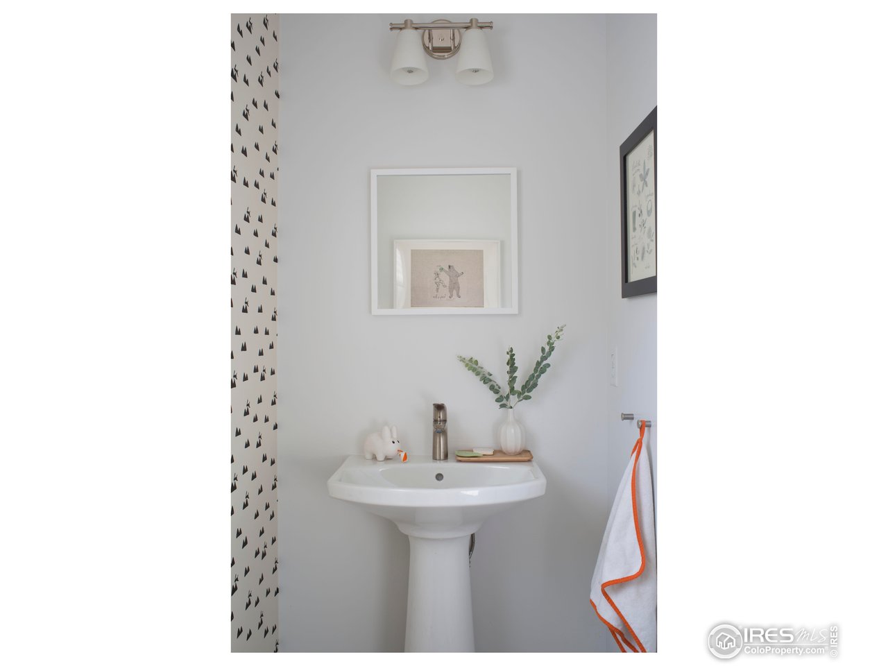 7531 Spring Drive Boulder, CO 80303 - Photo 14 of 35 a bathroom with a sink a mirror and a toilet