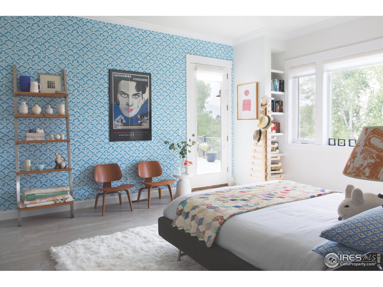 7531 Spring Drive Boulder, CO 80303 - Photo 16 of 35 a bedroom with a bed and a chair