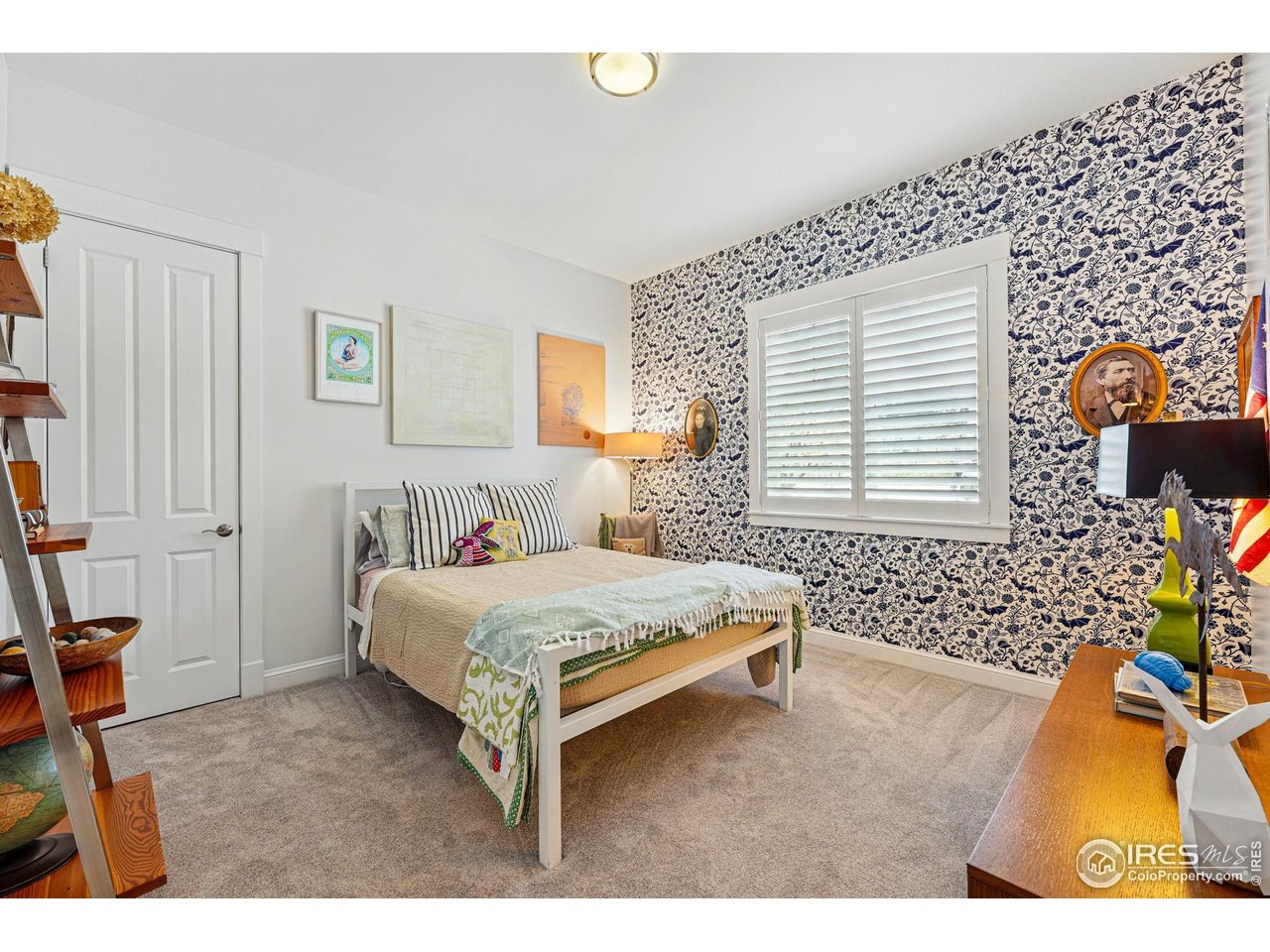 7531 Spring Drive Boulder, CO 80303 - Photo 19 of 35 a spacious bedroom with a bed and a window