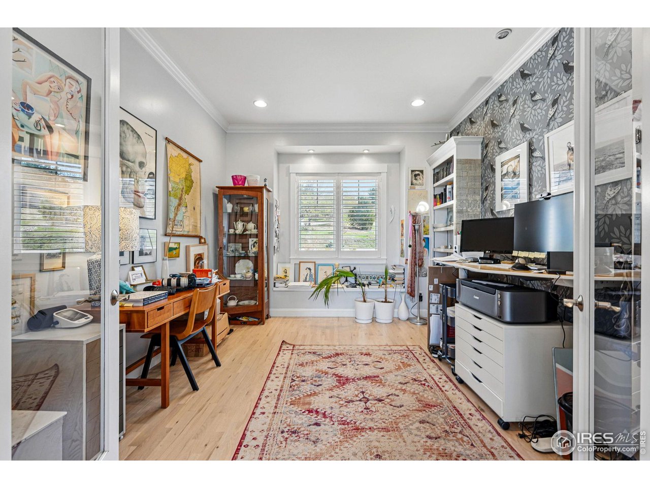 7531 Spring Drive Boulder, CO 80303 - Photo 22 of 35 a living room with furniture a dining table and a flat screen tv