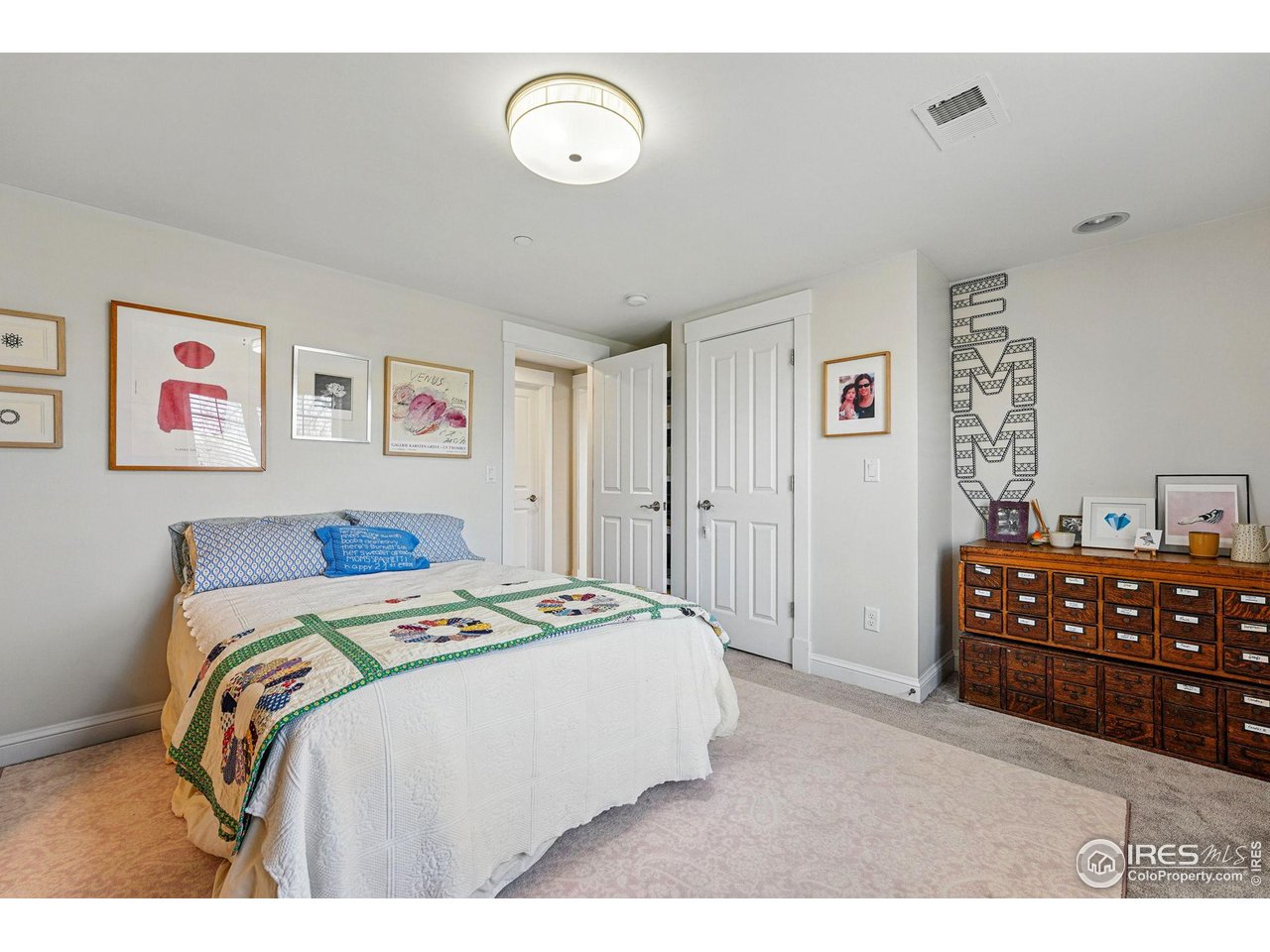 7531 Spring Drive Boulder, CO 80303 - Photo 26 of 35 a bedroom with a bed and cabinets