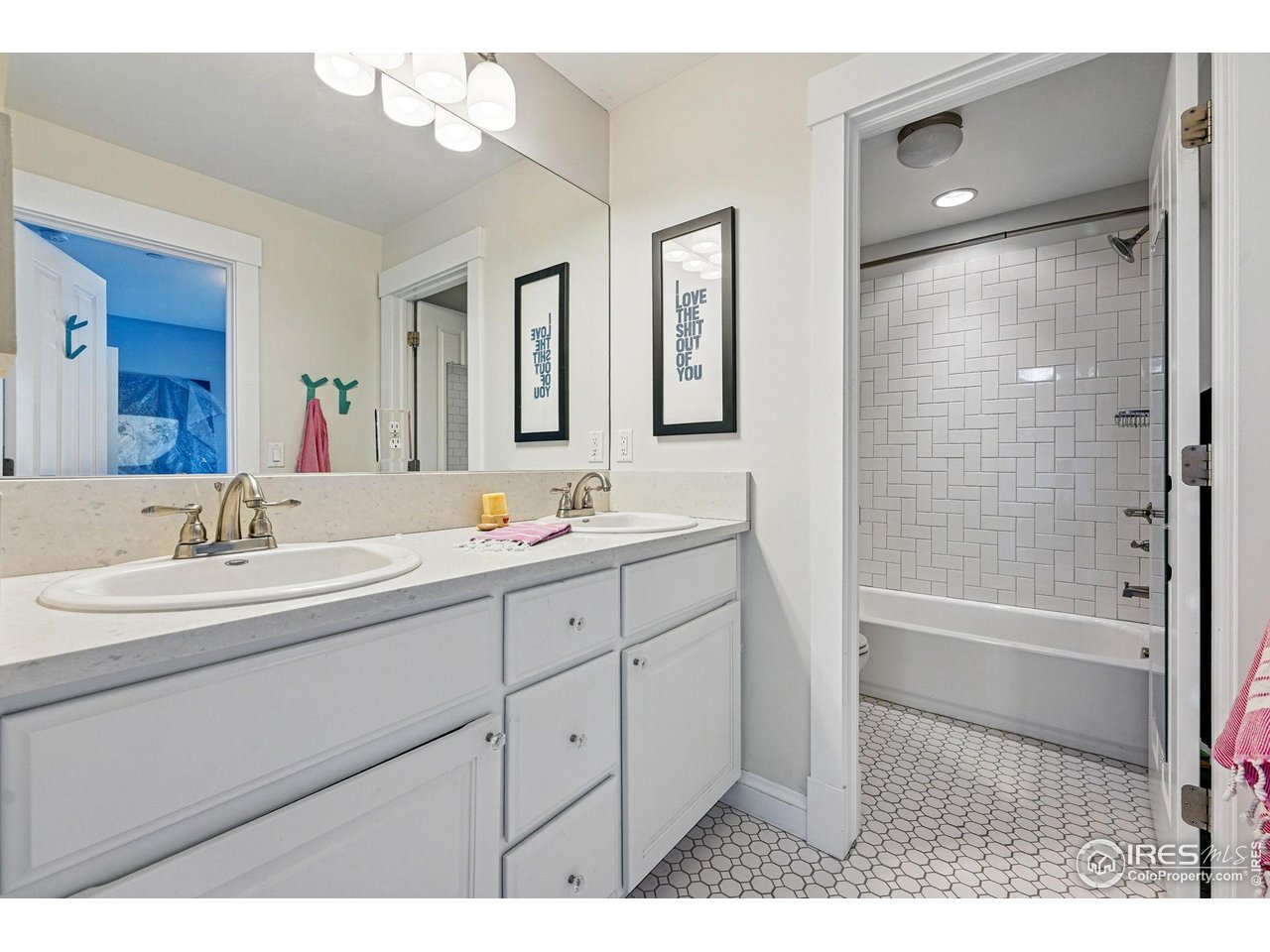 7531 Spring Drive Boulder, CO 80303 - Photo 27 of 35 a bathroom with a sink double vanity granite tub and shower
