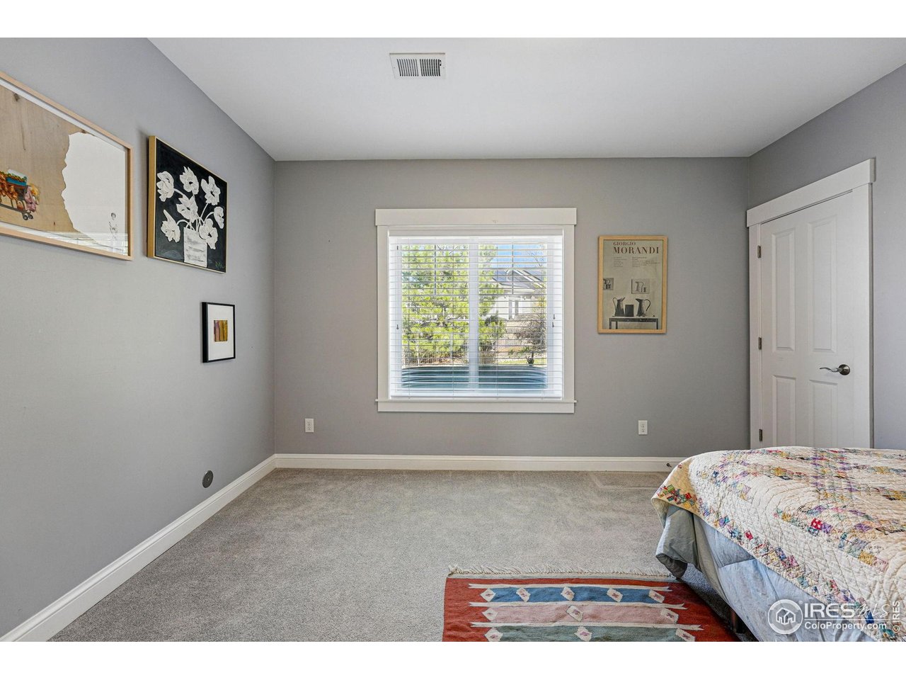 7531 Spring Drive Boulder, CO 80303 - Photo 28 of 35 a bedroom with a bed and a window