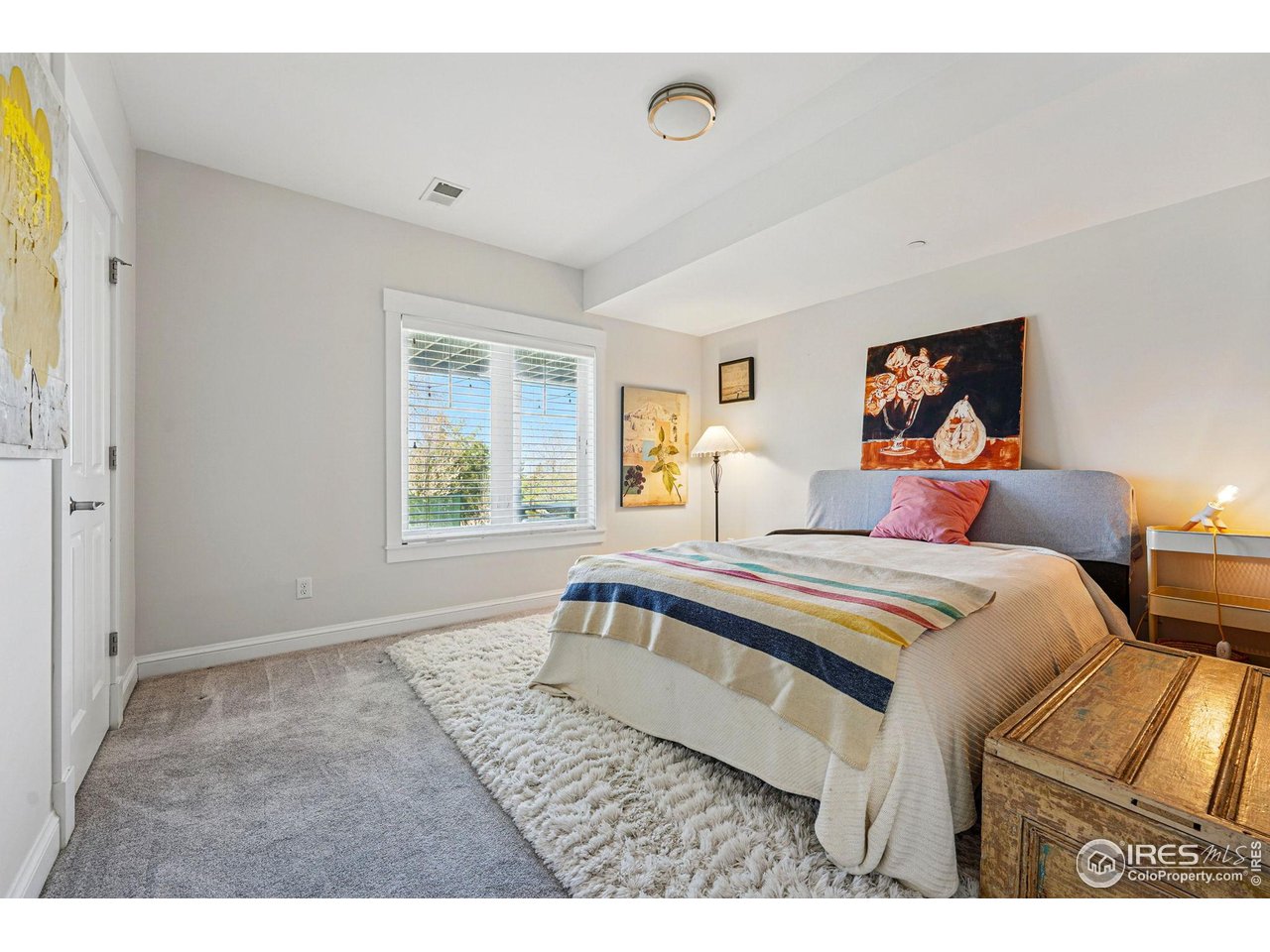 7531 Spring Drive Boulder, CO 80303 - Photo 29 of 35 a bedroom with a bed and a large window