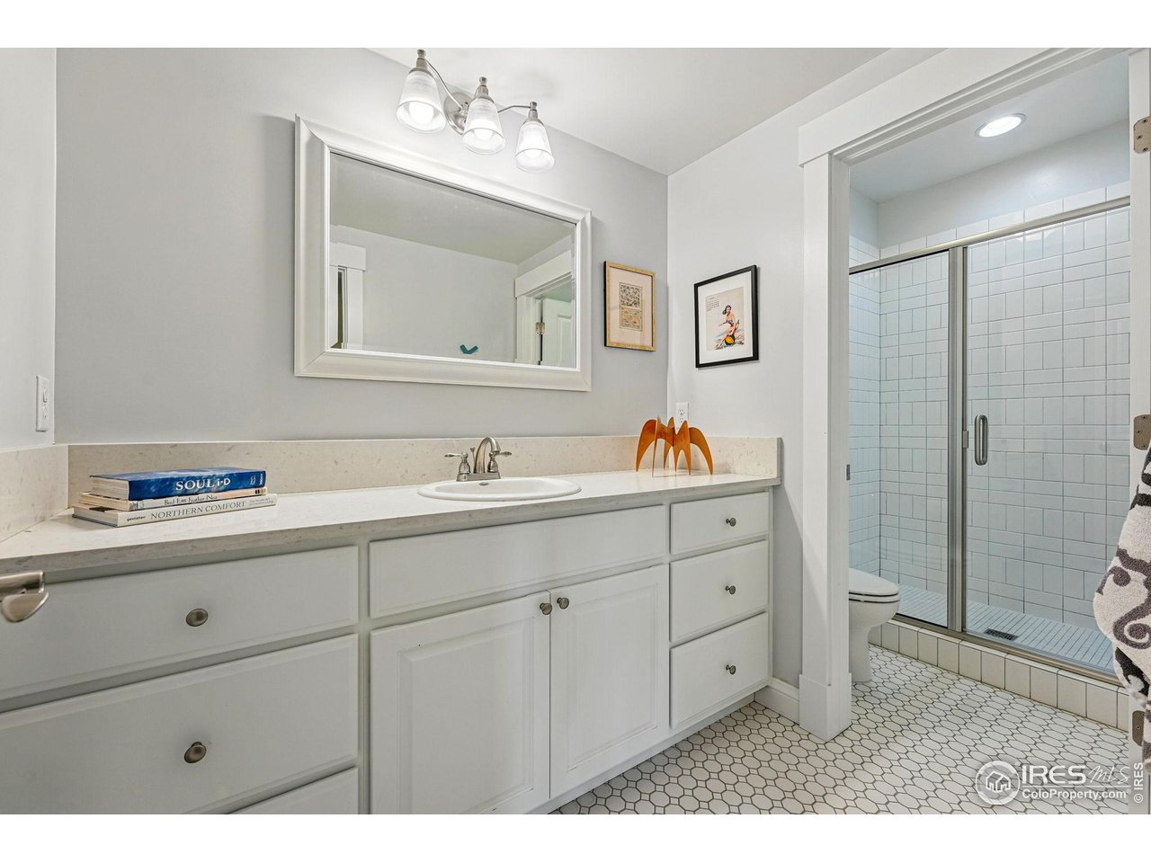7531 Spring Drive Boulder, CO 80303 - Photo 30 of 35 a bathroom with a sink double vanity and a mirror