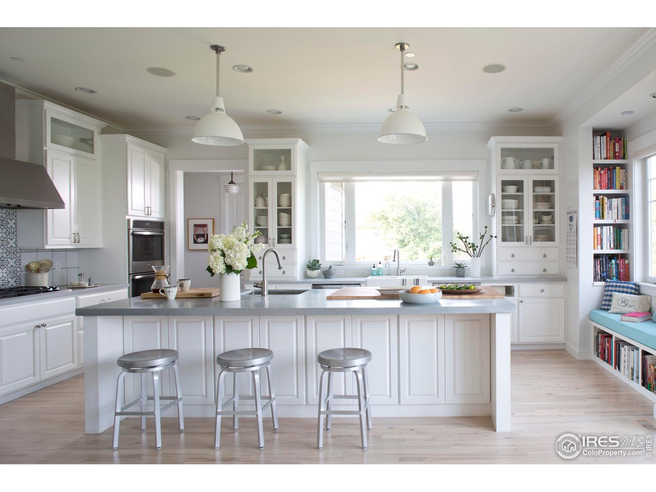 7531 Spring Drive Boulder, CO 80303 - Photo 7 of 35 a kitchen with kitchen island granite countertop a sink and cabinets