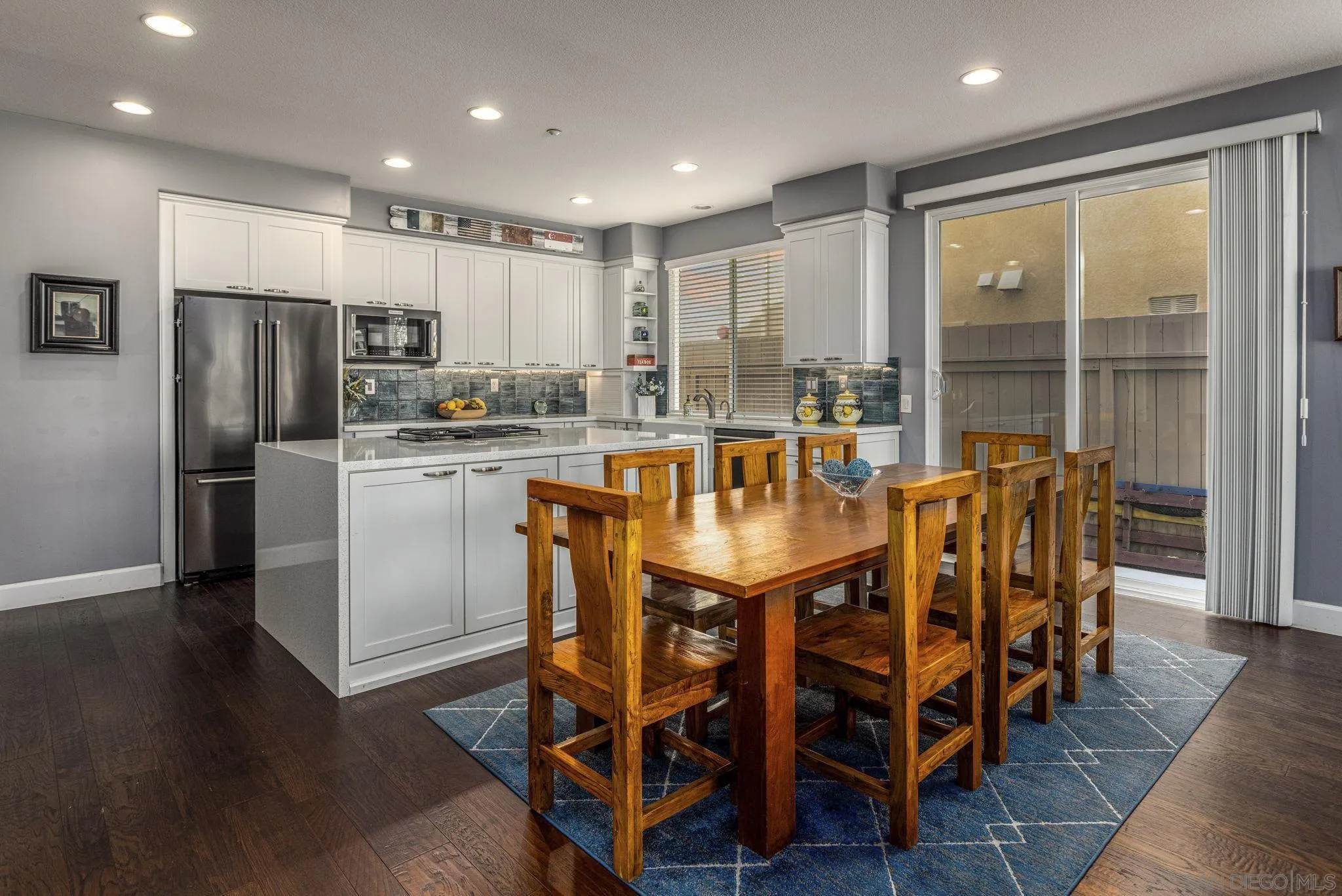 16778 Deer Ridge Road San Diego, CA 92127 - Photo 15 of 54 a dining table with chairs and wooden floor