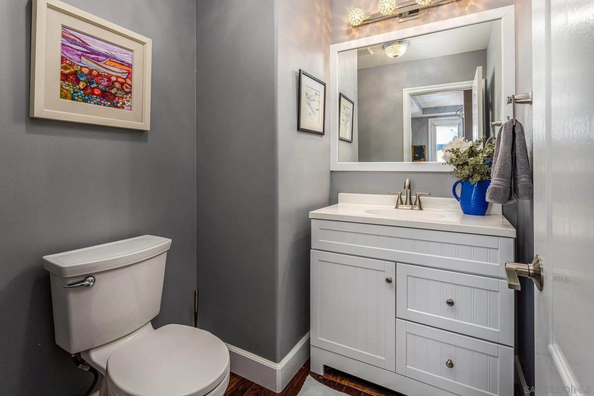 16778 Deer Ridge Road San Diego, CA 92127 - Photo 19 of 54 a bathroom with a toilet sink and mirror