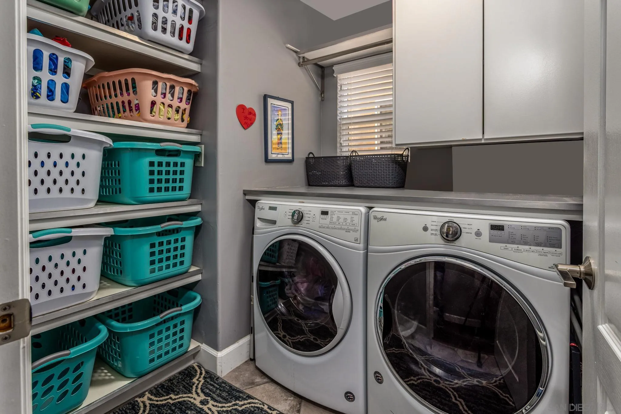 16778 Deer Ridge Road San Diego, CA 92127 - Photo 25 of 54 a view of a hallway with washer and dryer