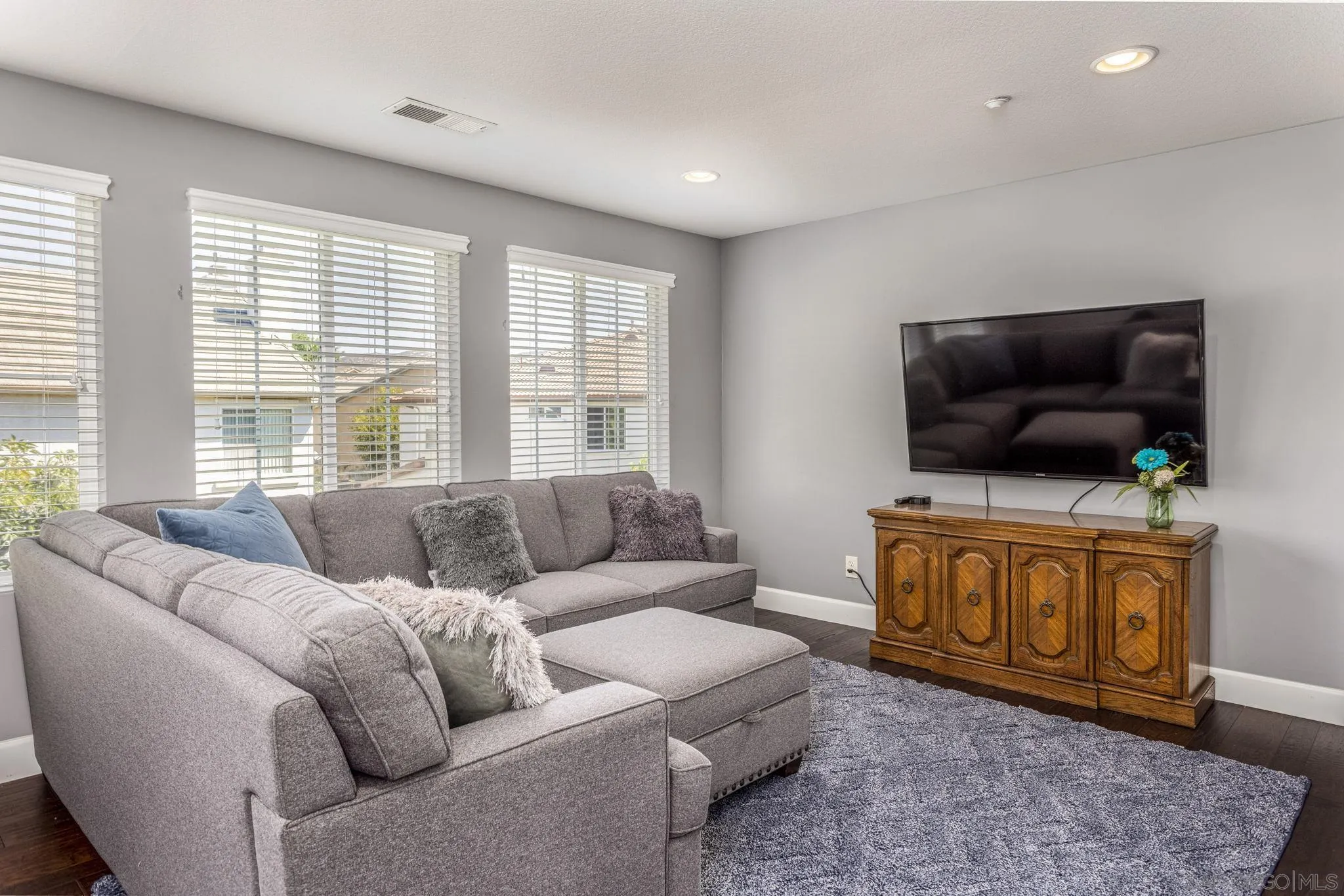 16778 Deer Ridge Road San Diego, CA 92127 - Photo 26 of 54 a living room with furniture and a flat screen tv