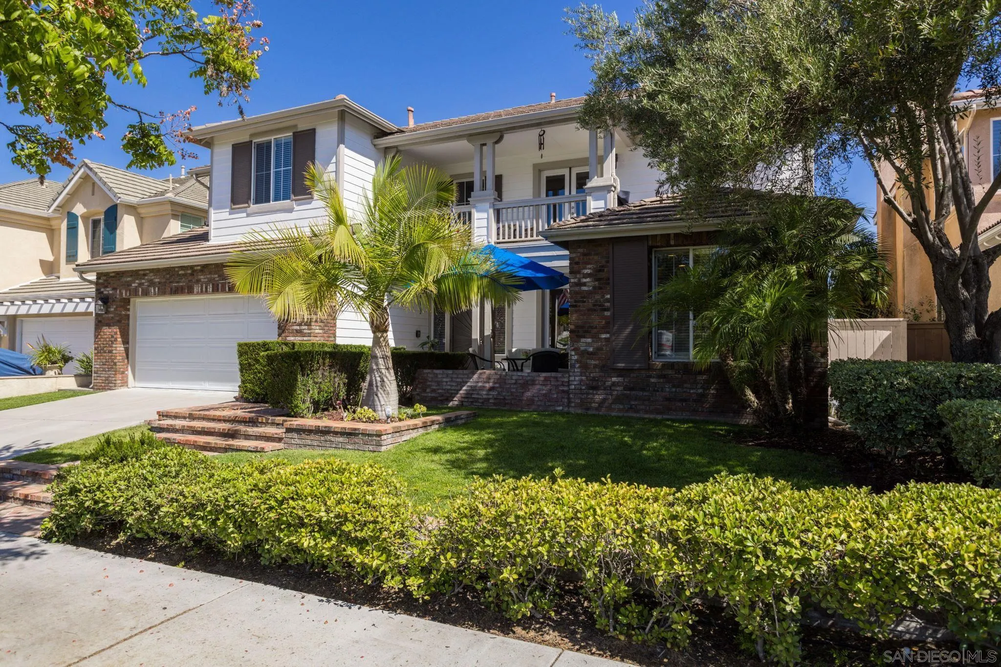 16778 Deer Ridge Road San Diego, CA 92127 - Photo 3 of 54 a front view of a house with garden
