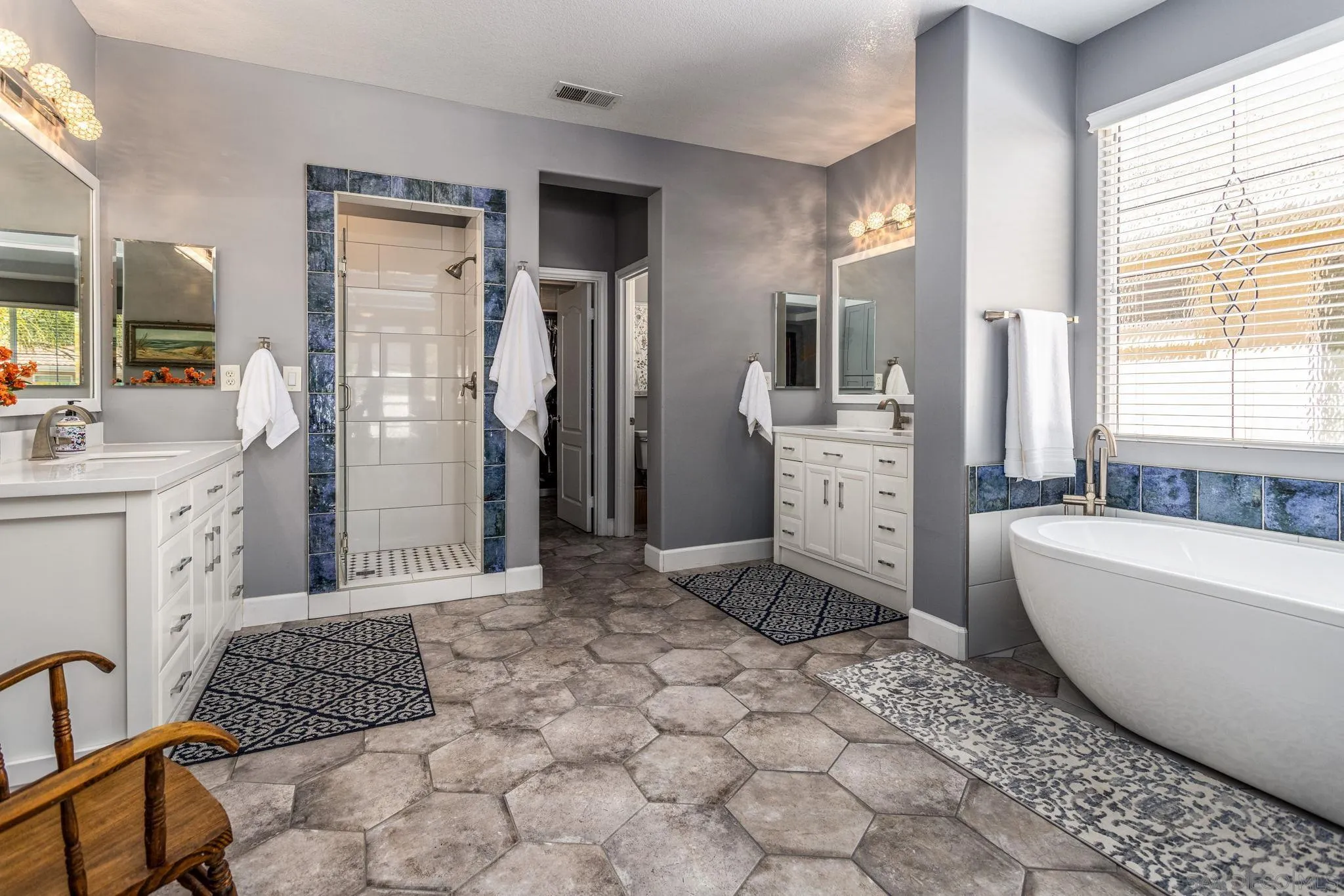 16778 Deer Ridge Road San Diego, CA 92127 - Photo 38 of 54 a spacious bathroom with a tub sink and mirror