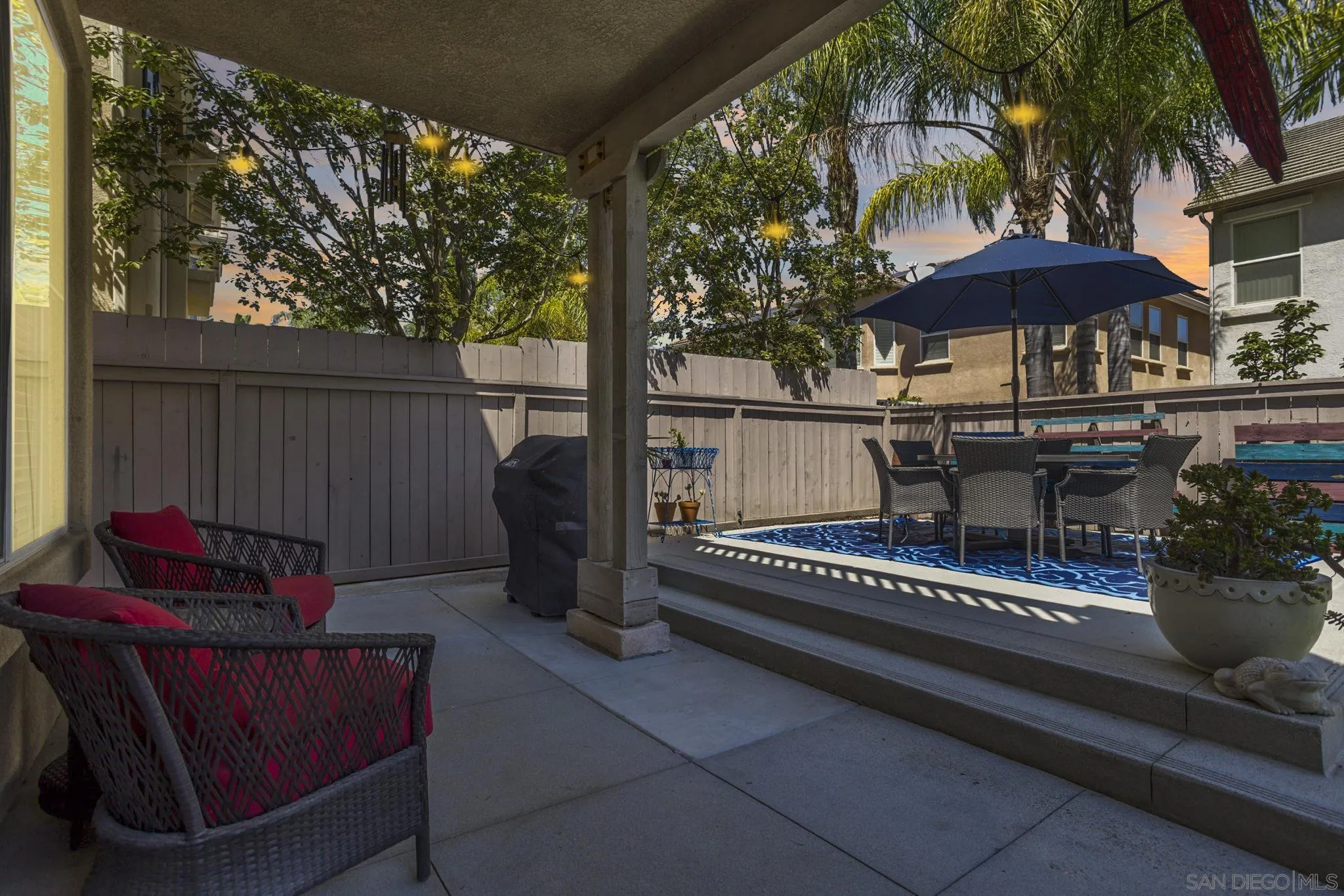 16778 Deer Ridge Road San Diego, CA 92127 - Photo 42 of 54 a view of a chairs and table in the back yard of the house