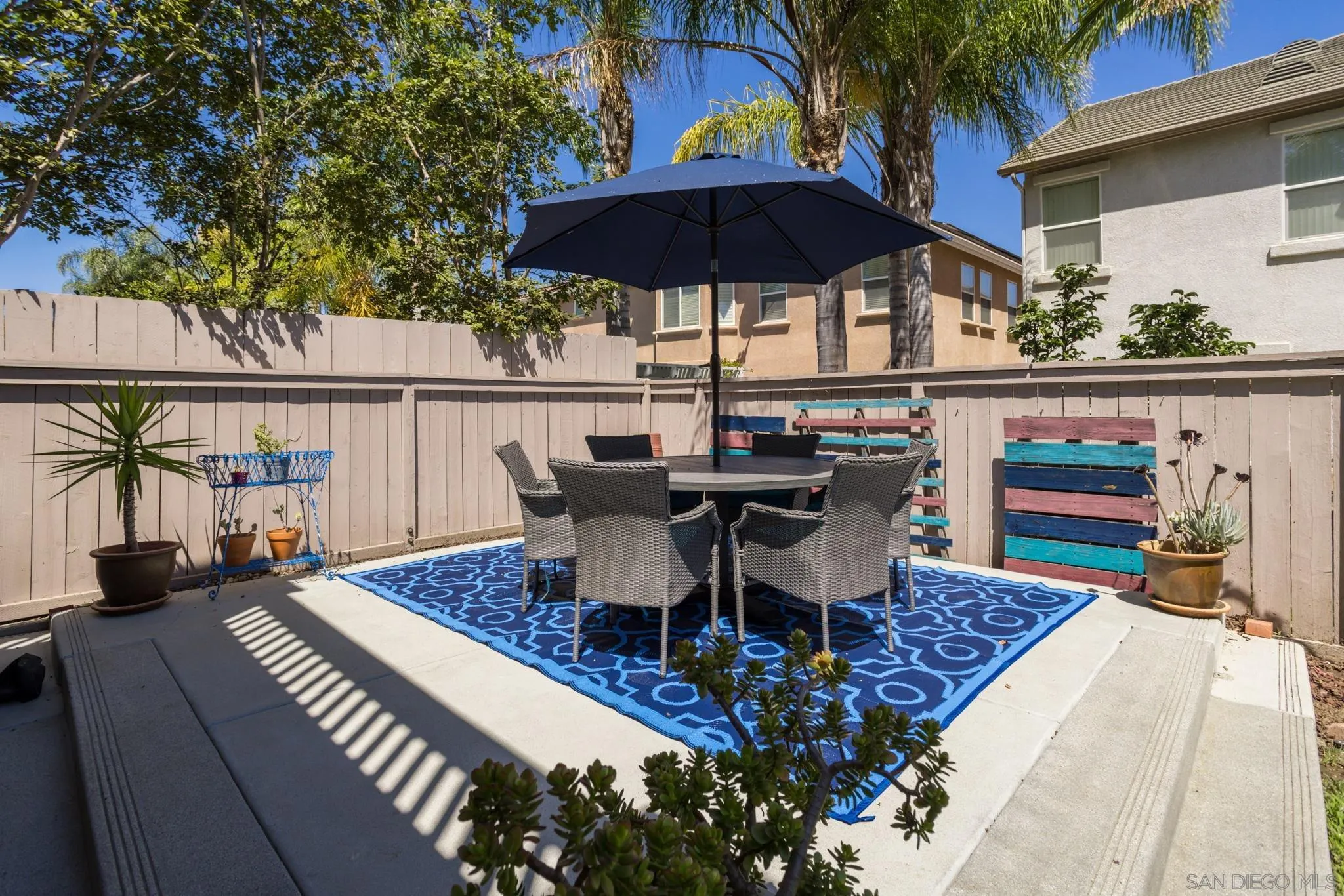 16778 Deer Ridge Road San Diego, CA 92127 - Photo 43 of 54 a view of a patio with furniture and umbrella