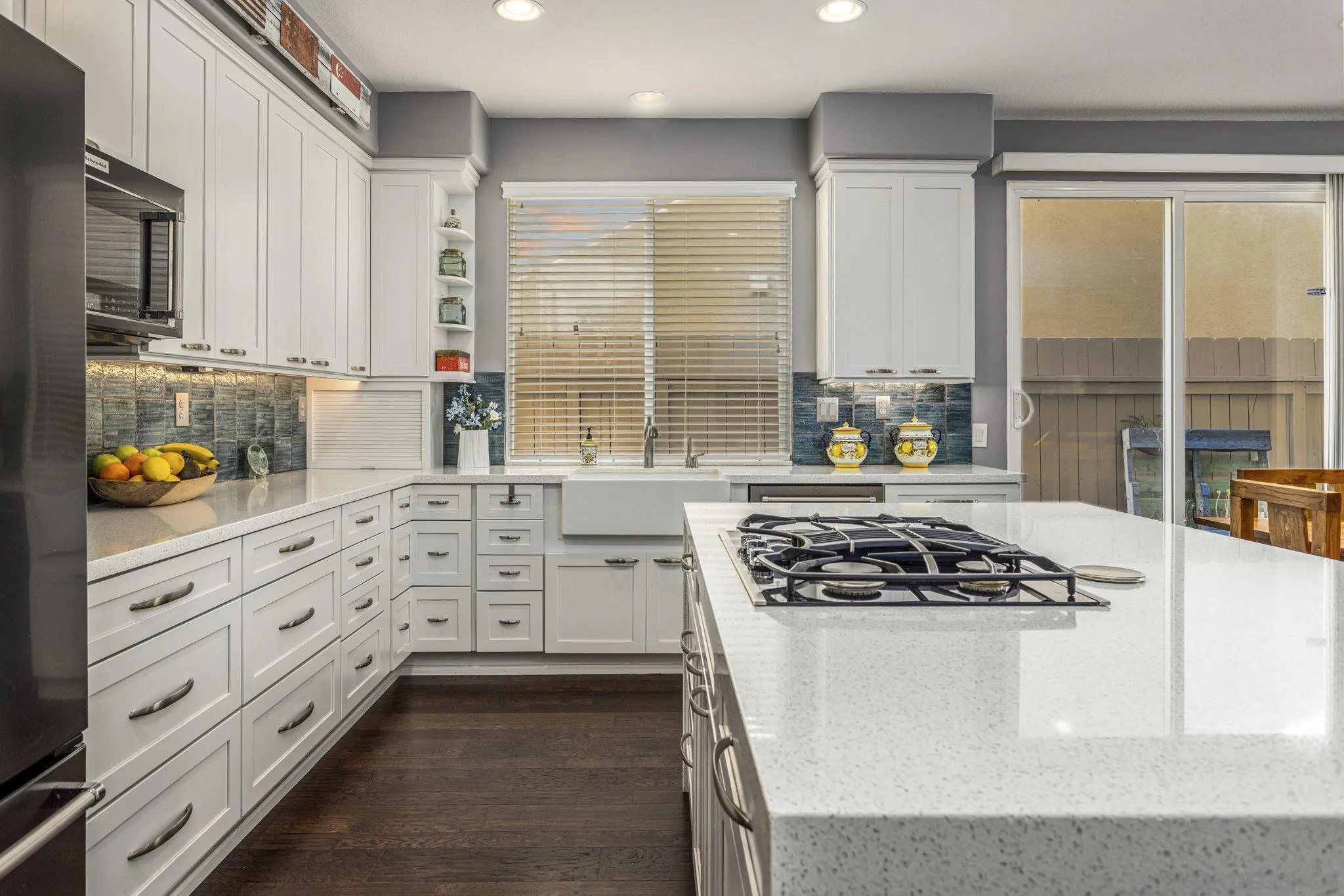16778 Deer Ridge Road San Diego, CA 92127 - Photo 7 of 54 a kitchen with white cabinets and appliances