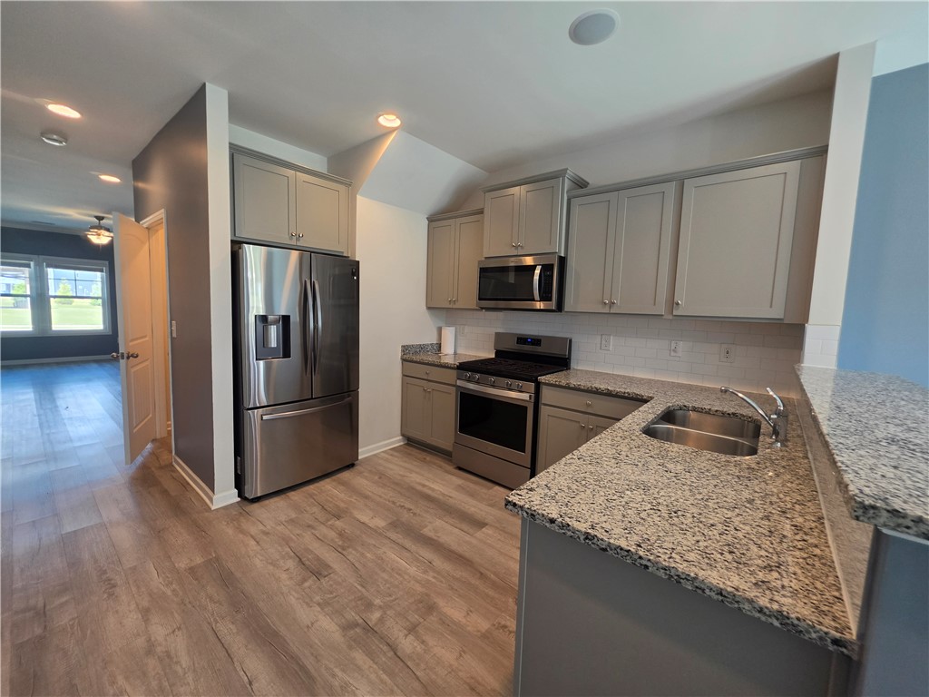 312 Phillips Drive Pendleton, SC 29670 - Photo 11 of 45 This kitchen features stylish appliances, ample cabinetry, and durable flooring.