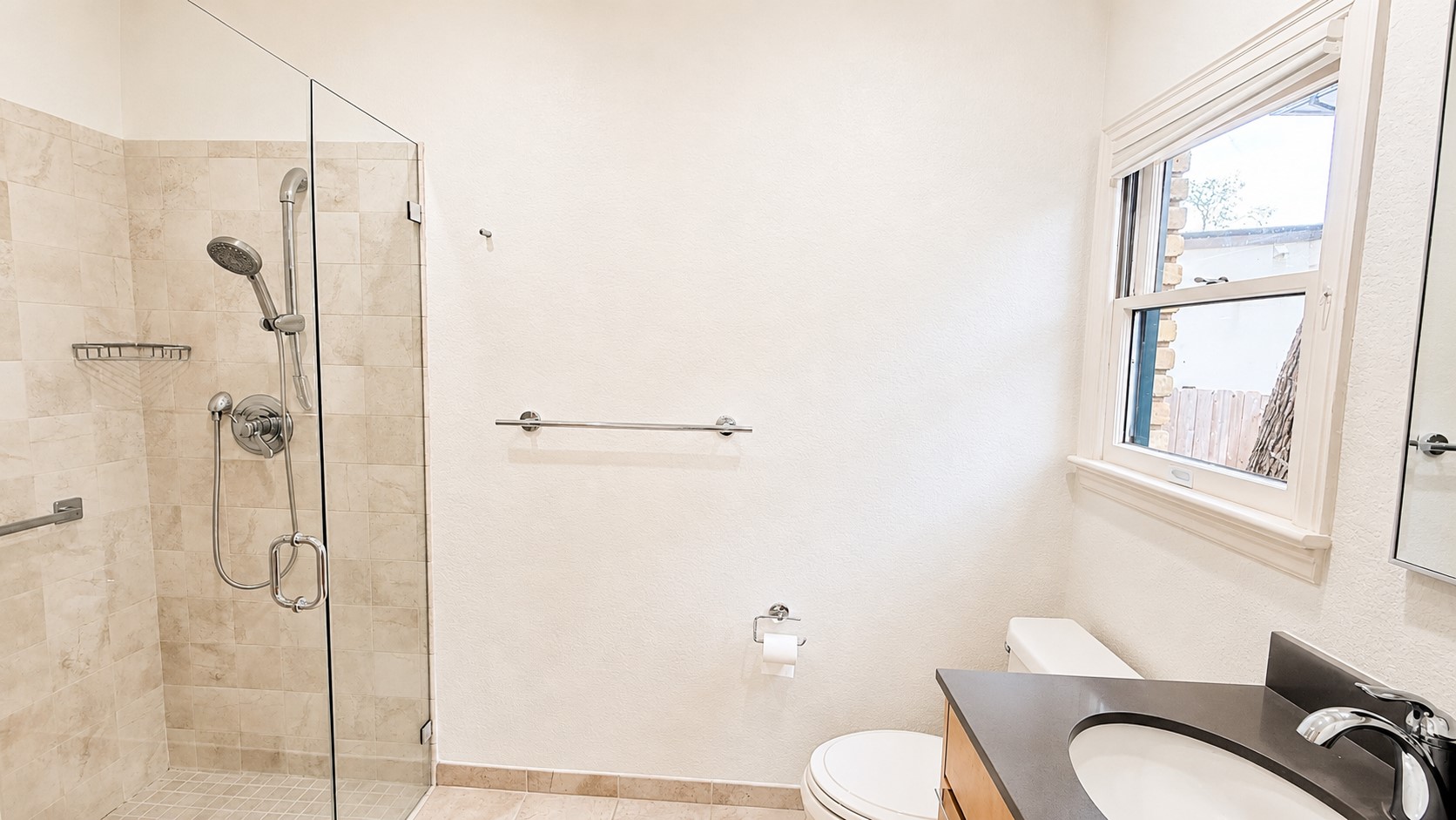 405 Ridgewood Road Austin, TX 78746 - Photo 15 of 22 Glass-enclosed shower with tiled walls