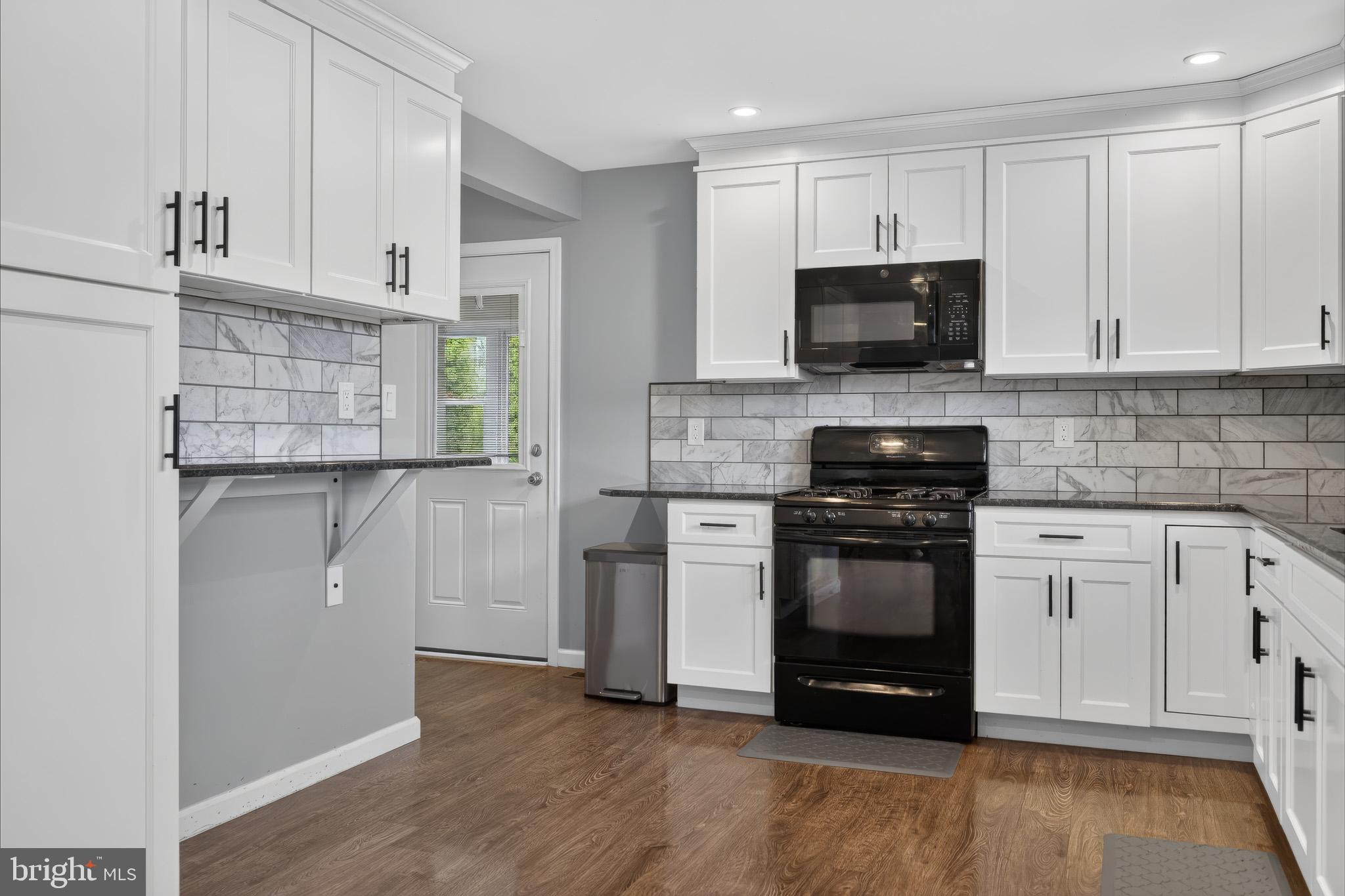 413 Broad Street Perkasie, PA 18944 - Photo 22 of 42 Modern kitchen with sleek finishes.