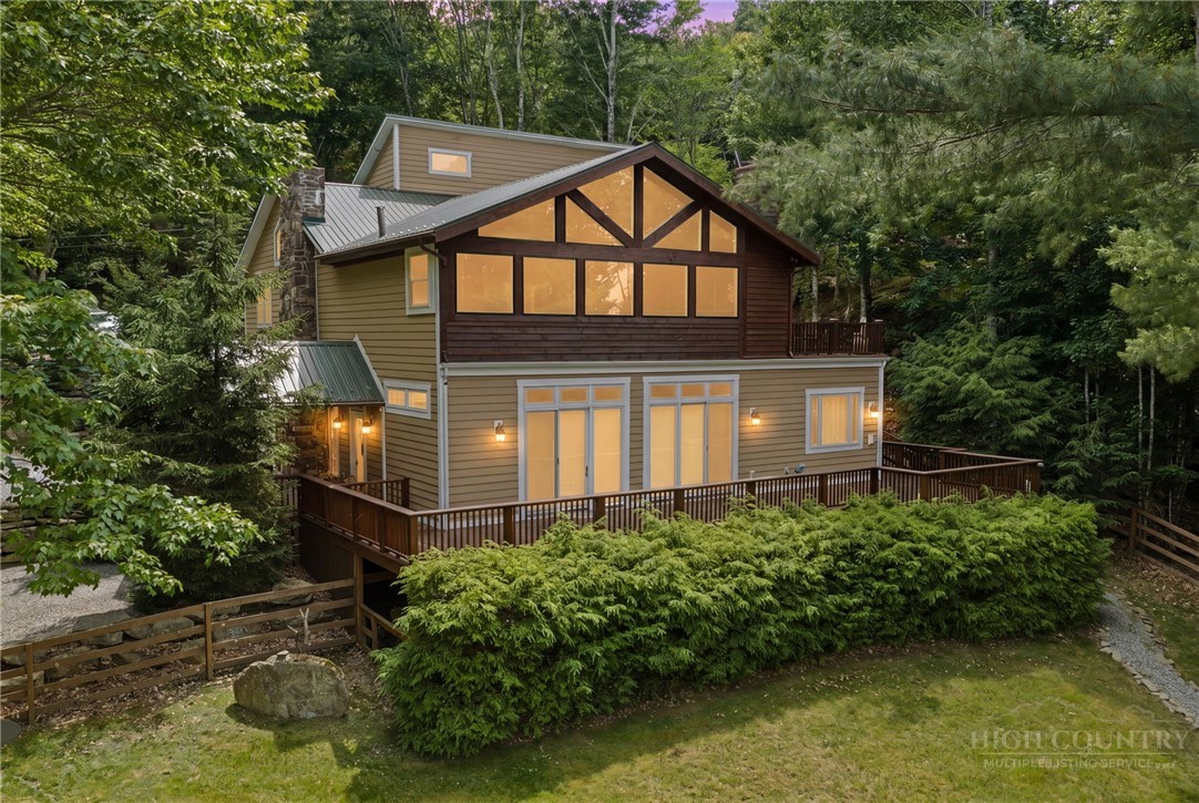 123 St Andrews Road Beech Mountain, NC 28604 - Photo 1 of 50 a front view of a house with a yard