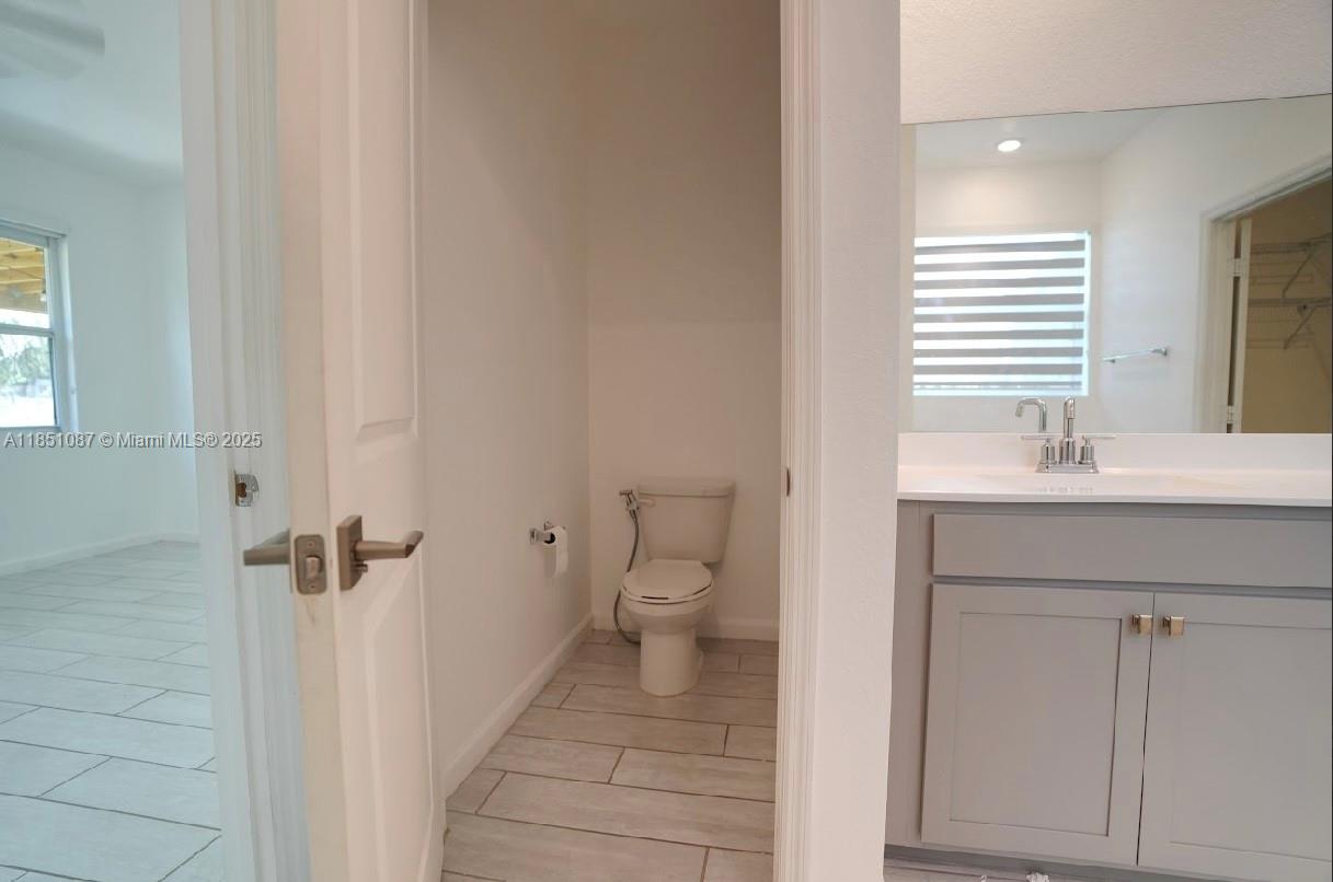 30600 Southwest 193rd Avenue Homestead, FL 33030 - Photo 23 of 36 a bathroom with a sink toilet and shower